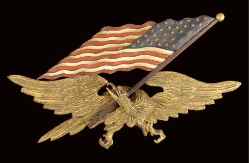 A CARVED, PAINTED, AND GILDED SPREAD-WING EAGLE