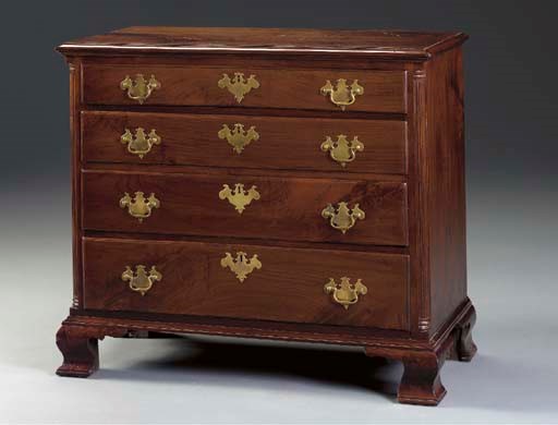 A CHIPPENDALE FIGURED WALNUT CHEST-OF-DRAWERS