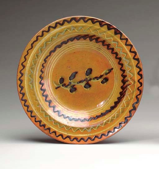 A GLAZED REDWARE CHARGER