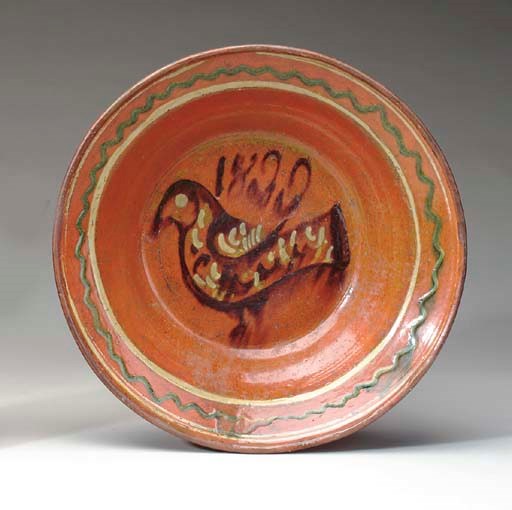 A GLAZED REDWARE CHARGER