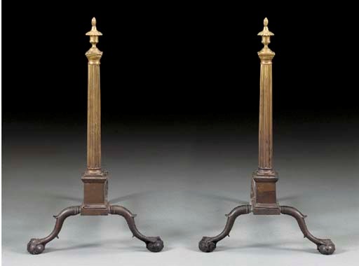 A PAIR OF CHIPPENDALE BRASS ANDIRONS