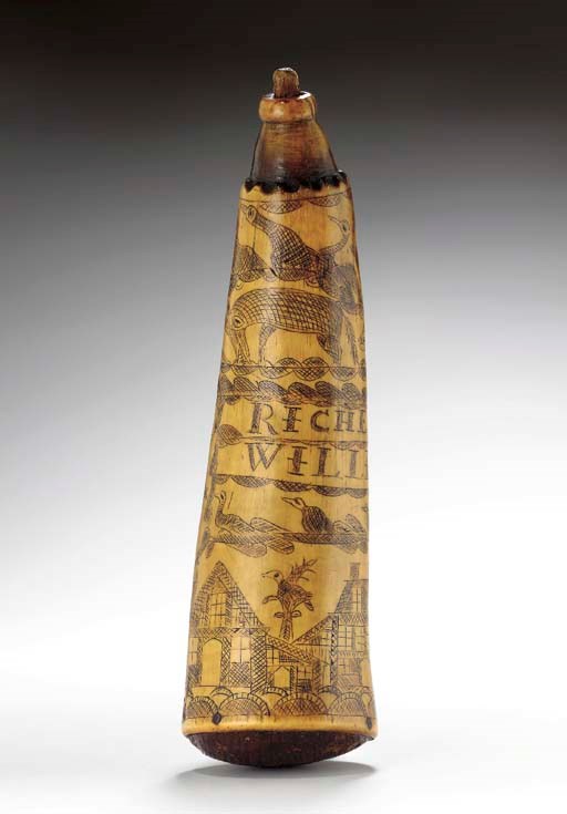 AN ENGRAVED POWDERHORN