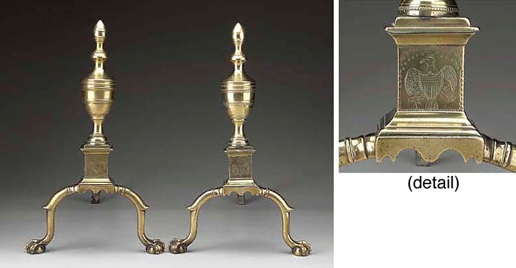 A PAIR OF CHIPPENDALE BRASS ANDIRONS