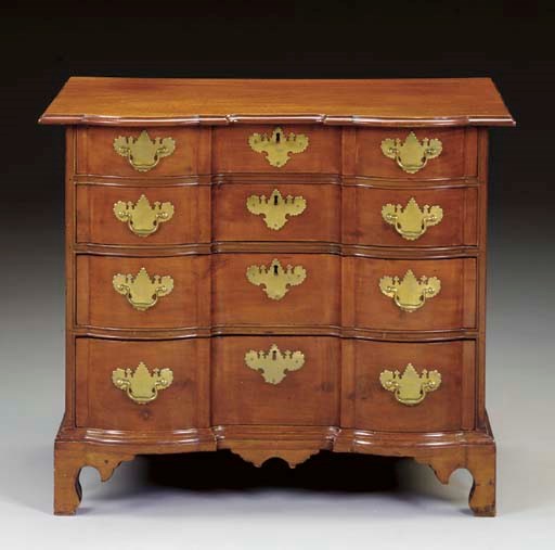 A CHIPPENDALE MAHOGANY BLOCK-FRONT CHEST-OF-DRAWERS