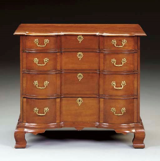 A CHIPPENDALE CHERRYWOOD BLOCK-FRONT CHEST-OF-DRAWERS