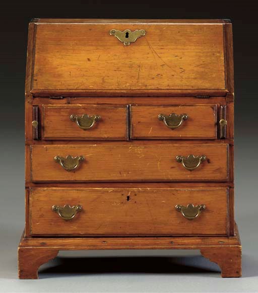 A CHIPPENDAL MINIATURE PINE SLANT-FRONT DESK