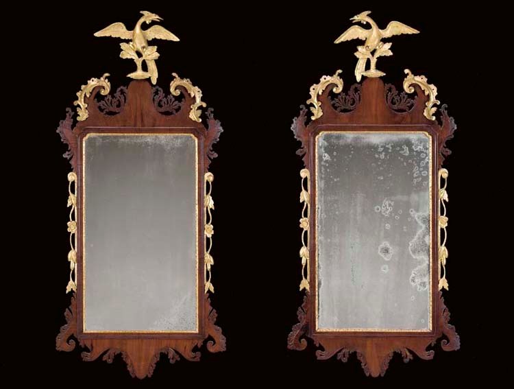 A PAIR OF CHIPPENDALE CARVED MAHOGANY AND GILTWOOD LOOKING GLASSES