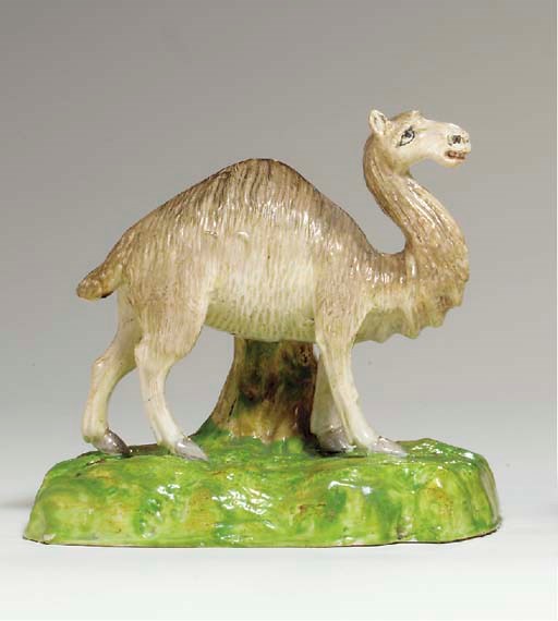 A STAFFORDSHIRE PEARLWARE SPILL VASE OF A CAMEL