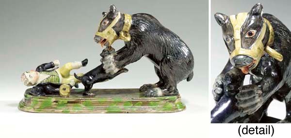 A STAFFORDSHIRE PEARLWARE FIGURE GROUP OF BEAR-BAITING