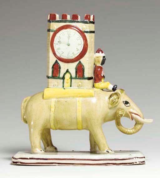A STAFFORDSHIRE PEARLWARE ELEPHANT SPILL VASE