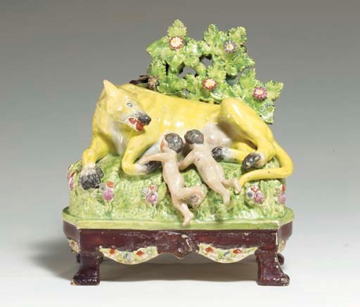 A STAFFORDSHIRE PEARLWARE FIGURE GROUP OF ROMULUS AND REMUS