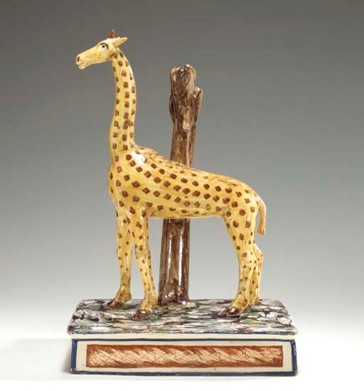 A CREAMWARE MODEL OF A GIRAFFE