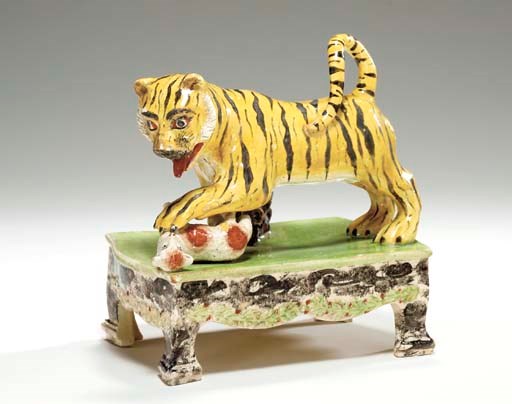 A STAFFORDSHIRE PEARLWARE FIGURE GROUP OF A TIGER ATTACKING A LAMB