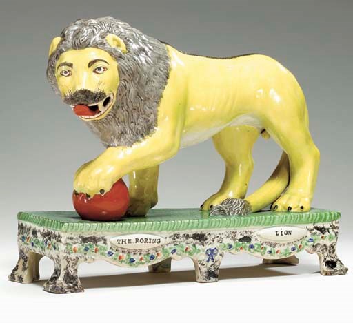 A STAFFORDSHIRE PEARLWARE MODEL OF 'THE ROARING LION'