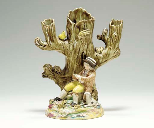 A STAFFORDSHIRE PEARLWARE NESTING-BIRD SPILL VASE