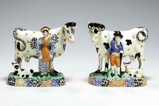 A PAIR OF STAFFORDSHIRE PEARLWARE MILKING GROUPS
