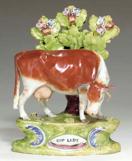 A STAFFORDSHIRE PEARLWARE MODEL OF 'CUP LADY'