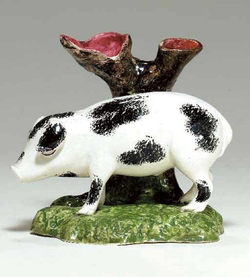 A BRITISH PEARLWARE MODEL OF A PIG
