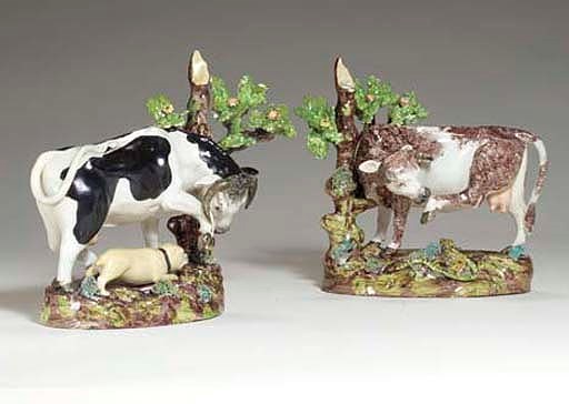 TWO STAFFORDSHIRE PEARLWARE MODELS OF A BULL AND A COW