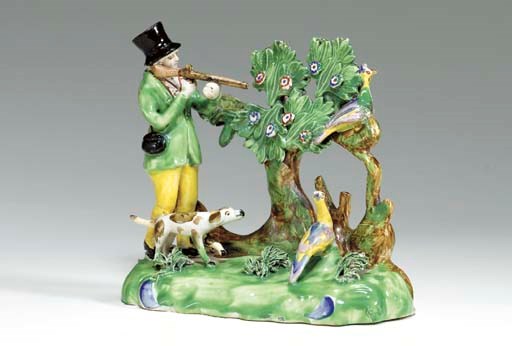 A STAFFORDHIRE PEARLWARE FIGURE GROUP OF PHEASANT SHOOTING