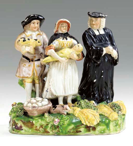 A STAFFORDSHIRE PEARLWARE 'TITHE PIG' GROUP