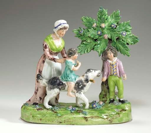 A STAFFORDSHIRE PEARLWARE FIGURE GROUP OF A YOUNG FAMILY PLAYING