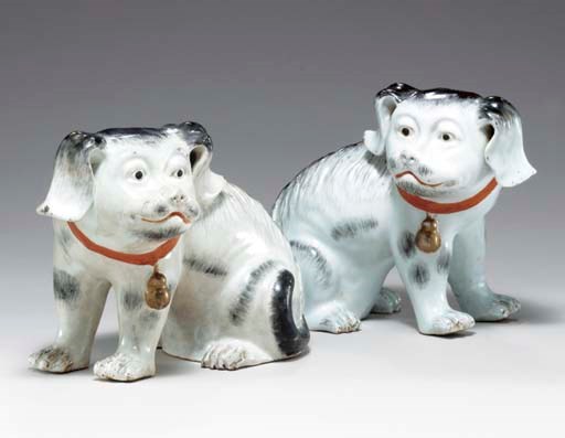 A PAIR OF BLACK AND WHITE PUPPIES