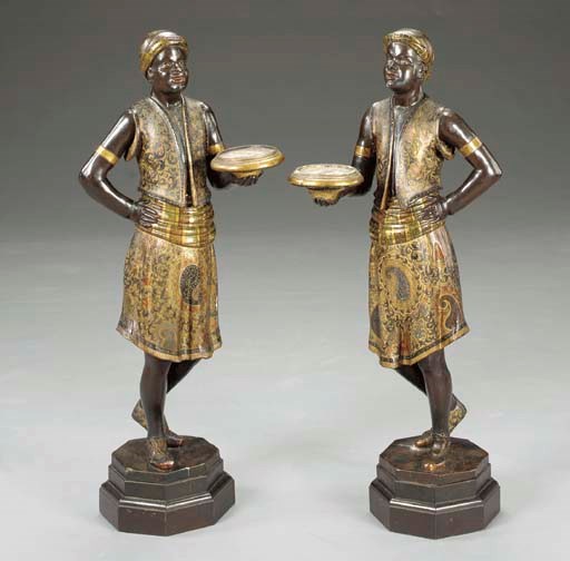 A pair of Venetian polychrome decorated carved wood blackamoors,