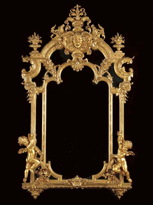 A Continental Baroque style giltwood mirror,