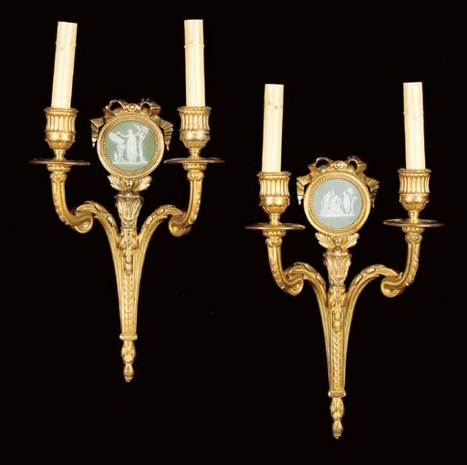 A pair of Louis XVI style jasperware-mounted twin-light ormolu wall appliques,