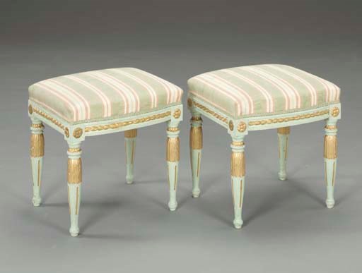 A PAIR OF LOUIS XVI STYLE GREEN PAINTED AND PARCEL-GILT TABOURETS,