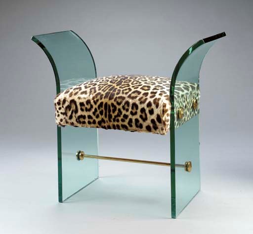 AN AMERICAN UPHOLSTERED PLATE GLASS AND BRASS VANITY BENCH,