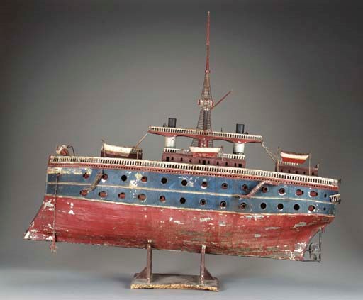 A PAINTED METAL MODEL OF A STEAM BATTLASHIP,