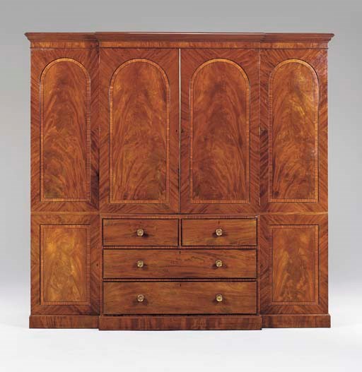 A GEORGE IV MAHOGANY BREAKFRONT WARDROBE