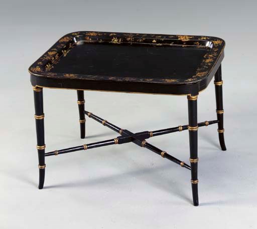 A VICTORIAN BLACK AND GILT JAPANNED PAPIER MACHE TRAY ON LATER STAND,