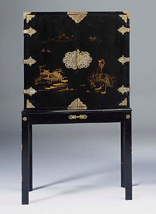 A black lacquered and chinoiserie decorated cabinet on stand, late 19th early 20th century