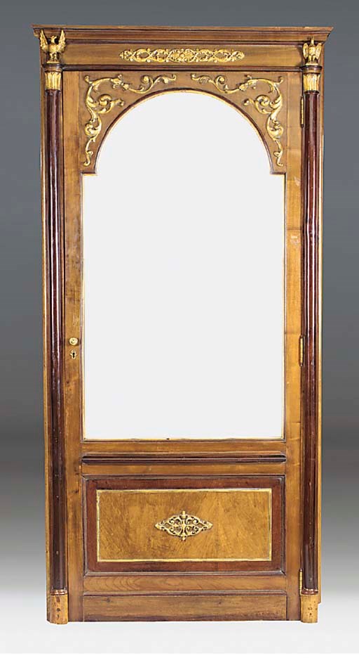 A North European mahogany and parcel gilt door, early 19th century