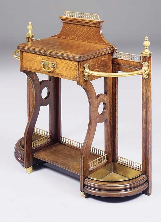 AN EARLY VICTORIAN BRASS-MOUNTED OAK HALL STAND
