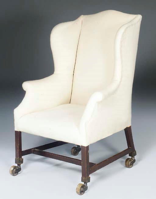 A GEORGE III MAHOGANY WING ARMCHAIR