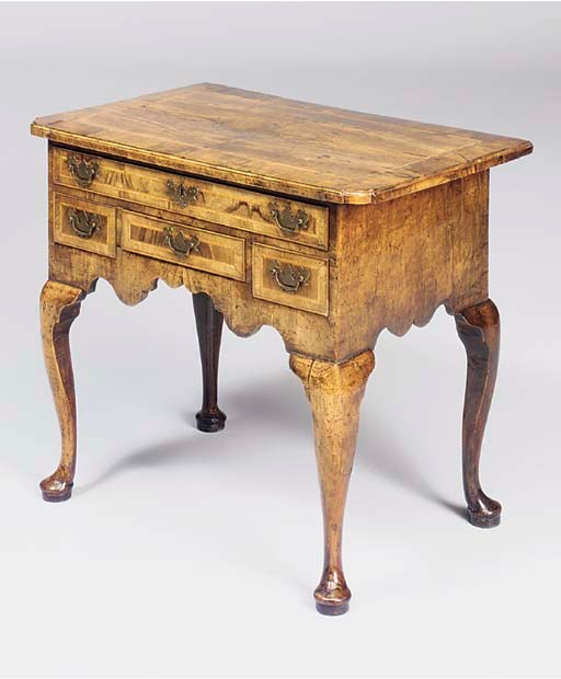 A GEORGE II WALNUT LOWBOY