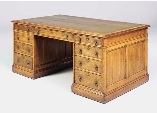 AN EARLY VICTORIAN OAK PARTNER'S DESK