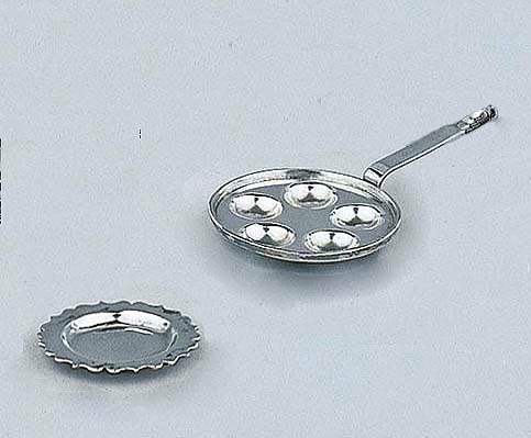 A Dutch silver miniature "poffertjes pan" and a dish
