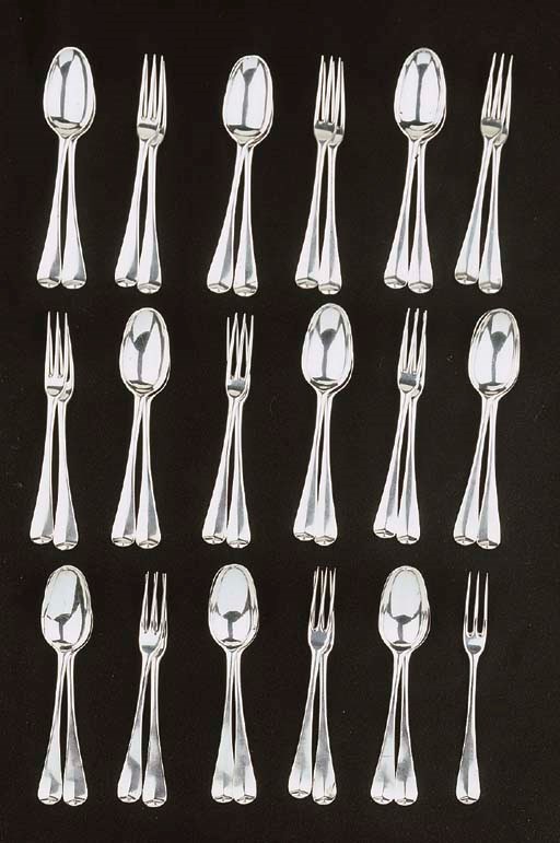 Seventeen English silver dessert forks and eighteen dessert spoons