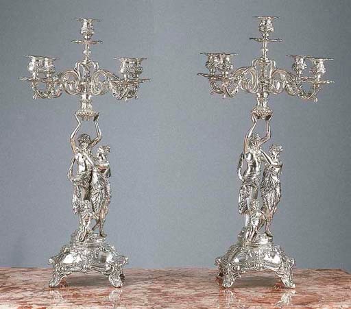 Two five-light silver candelabra