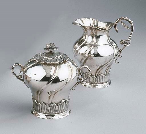 A Dutch silver milk jug and sugar basin