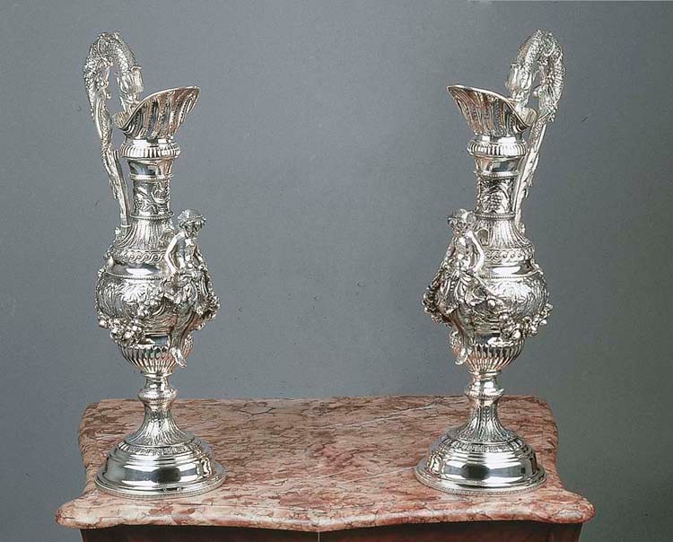 A pair of large silver jugs