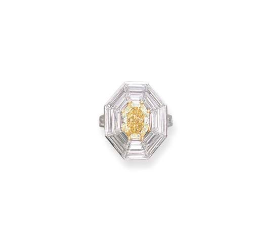 A FANCY YELLOW DIAMOND AND DIAMOND RING, BY GRAFF