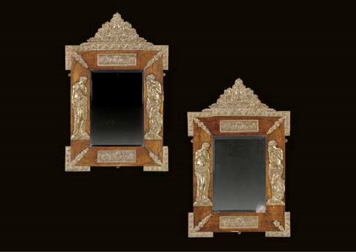 A PAIR OF RENAISSANCE STYLE PRESSED BRASS-MOUNTED BROWN OAK MIRRORS,