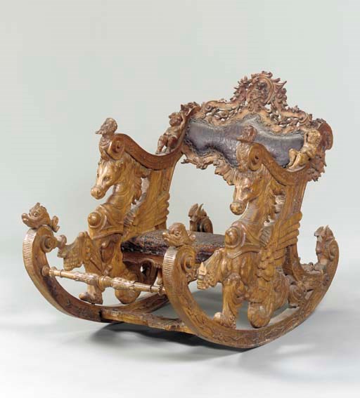 AN ITALIAN BAROQUE STYLE WALNUT ROCKING CHAIR,