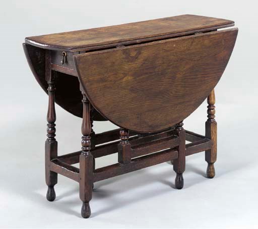 AN ENGLISH PROVINCIAL OAK GATELEG TABLE,